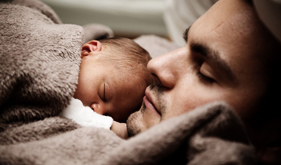 Baby and father co-sleeping