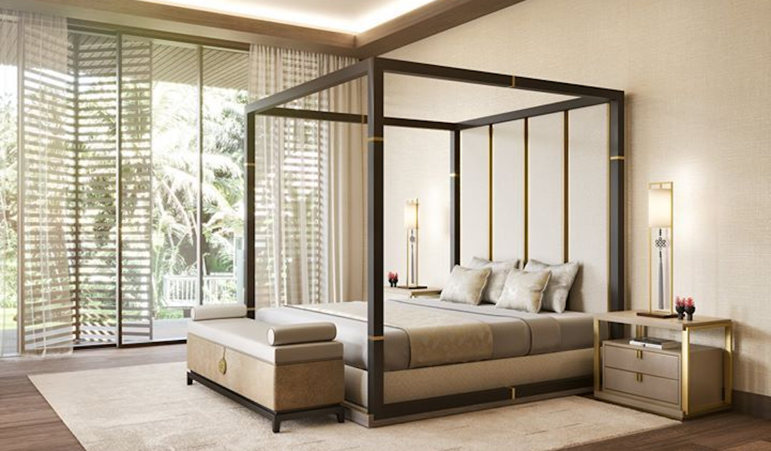 Modern glam bedroom with golden lamps and bold four poster bed.