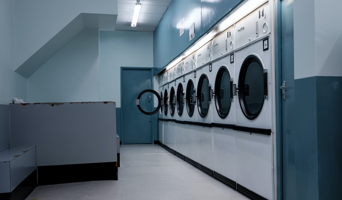 A row of industrial washing machines.