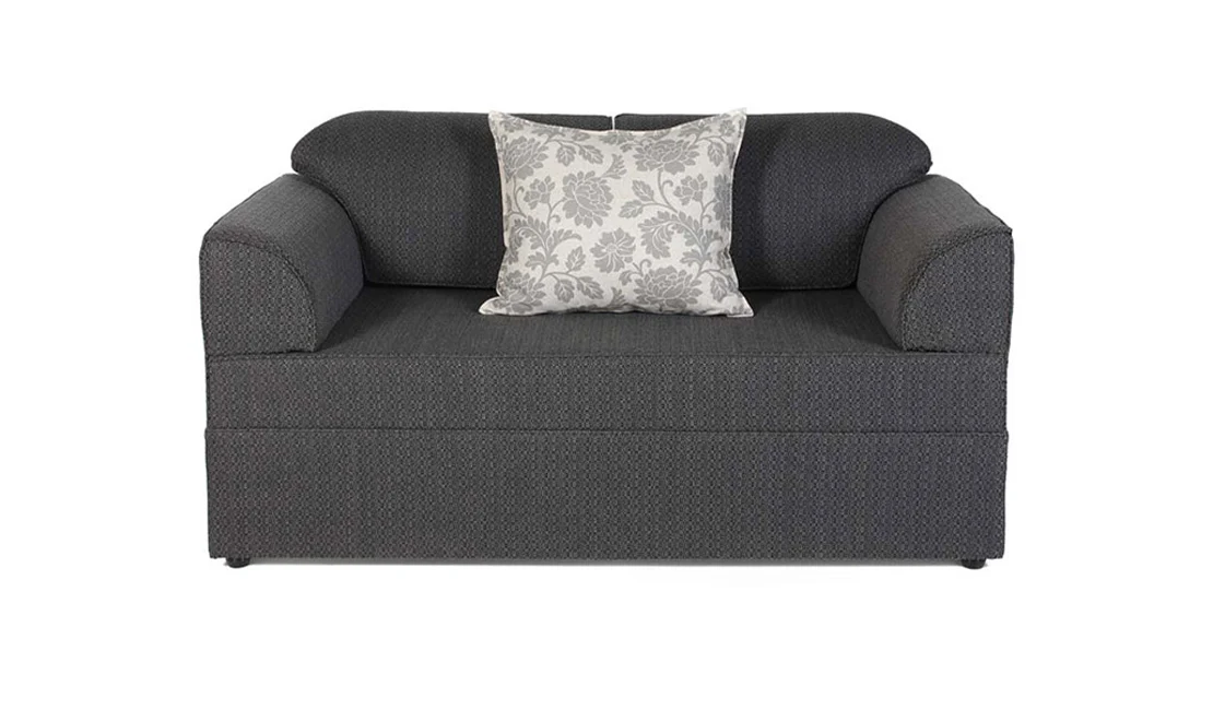 Customizable grey sleeper couch with a floral pillow.