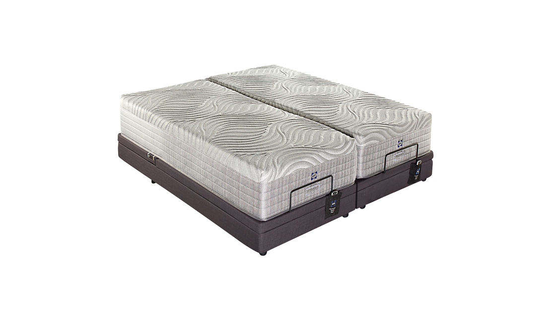 Two off-white mattresses atop an elegant adjustable base gives the Sealy Posturematic Odessa a look of sophistication and style.