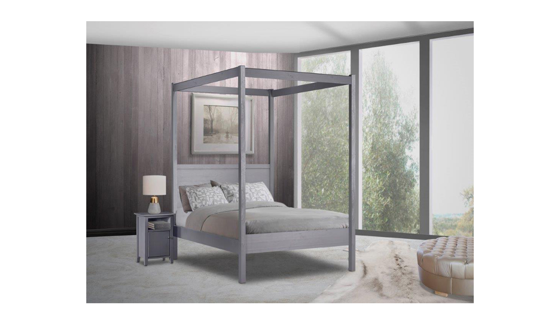 Four-poster wooden beds like this charcoal grey one fits in beautifully in earthy bedrooms.