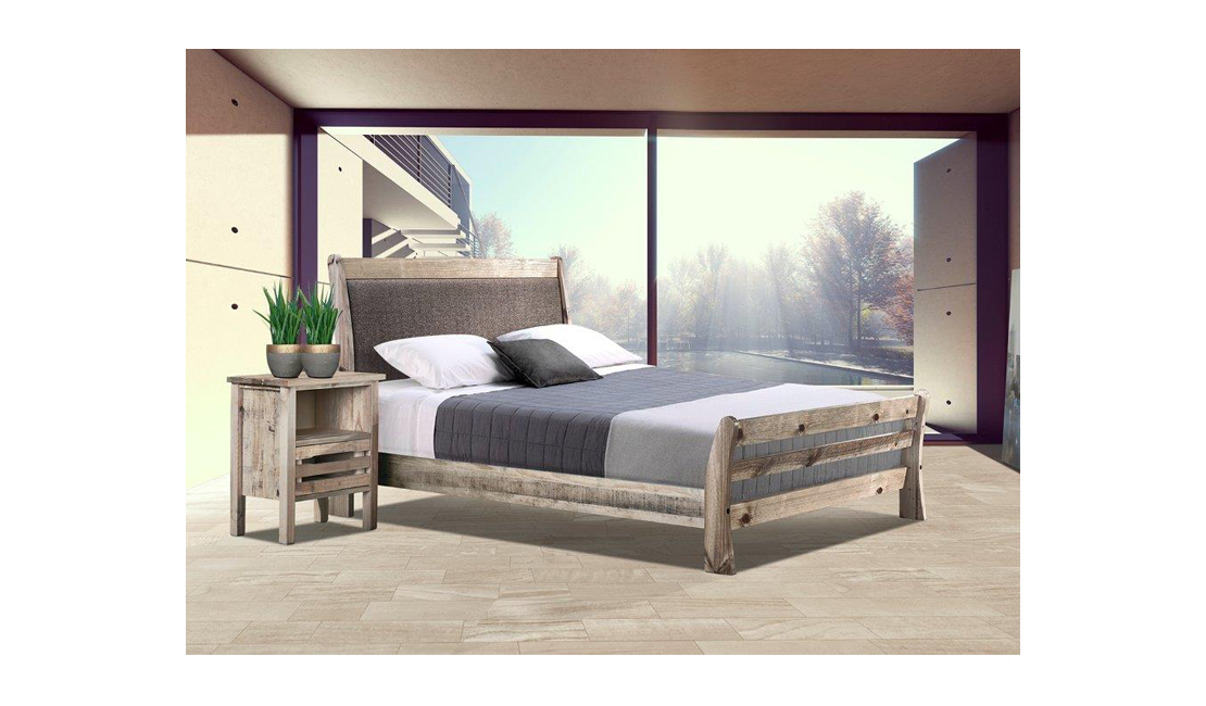 Rugged wooden bed frame in a sunny bedroom.