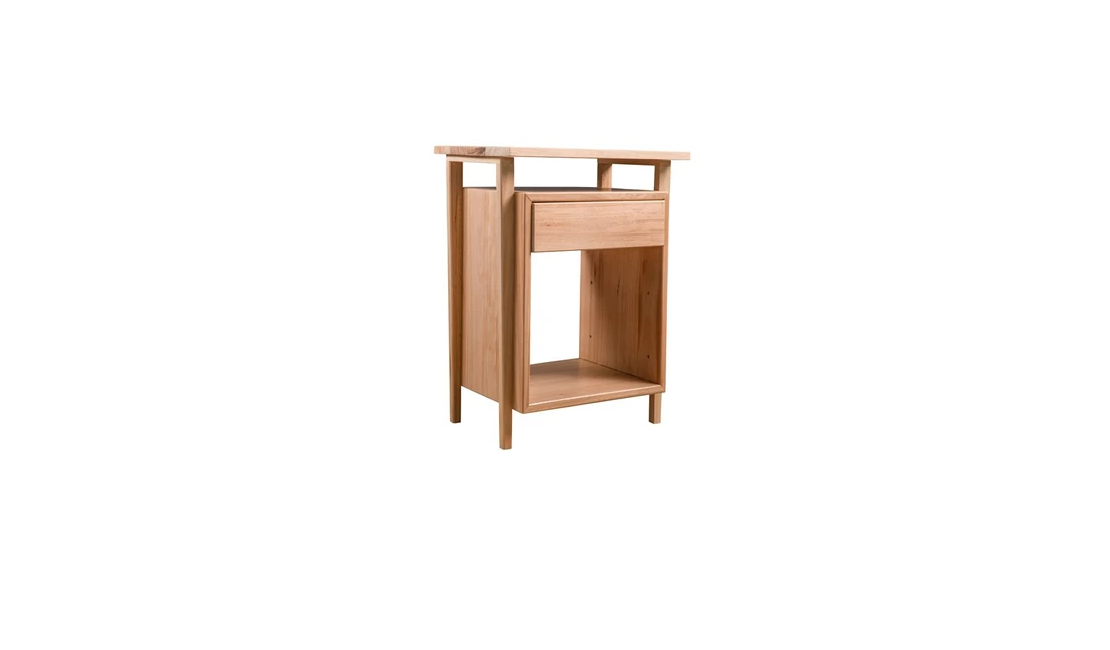 A bedside table with a drawer and a large storage space beneath the drawer.